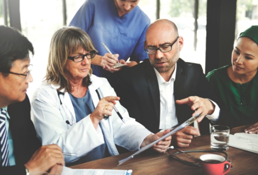 four business people discussing