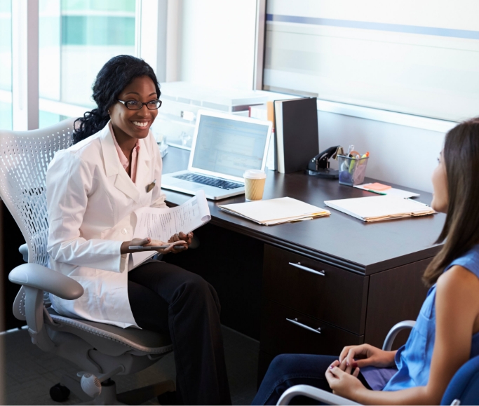 nurse talking to a patient in their office